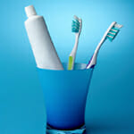 toothbrushes in a cup